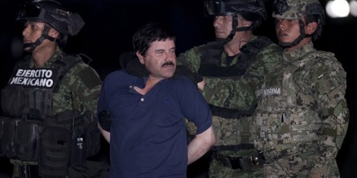 Joaquin "El Chapo" Guzman as he is escorted to a helicopter in handcuffs by Mexican soldiers and marines, Mexico City, Mexico, Jan. 8, 2016 (AP photo by Marco Ugarter).