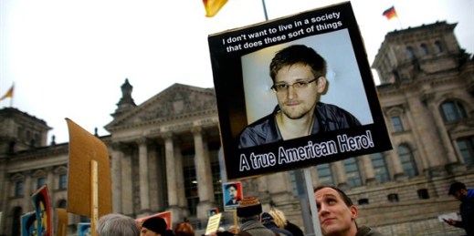 Protesters hold posters of Edward Snowden in front of the German parliament, Berlin, Germany, Nov. 18, 2013 (AP photo by Markus Schreiber).