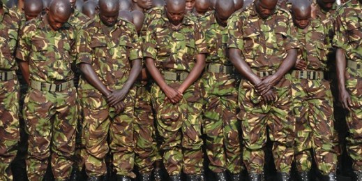 Kenyan soldiers pay their respects at a memorial service honoring soldiers killed while on peacekeeping duty in Somalia, Eldoret, Kenya, Jan. 27, 2016 (AP photo by John Muchucha).