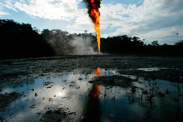 Burning oil jets from a well set ablaze by FARC rebels in rural Puerto Asis, Putumayo, Colombia Aug. 13, 2003 (AP photo by Javier Galeano).