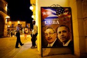 A poster of Cuban President Raul Castro and U.S. President Barack Obama outside a restaurant in Havana, Cuba, March 17, 2016 (AP photo by Ramon Espinosa).
