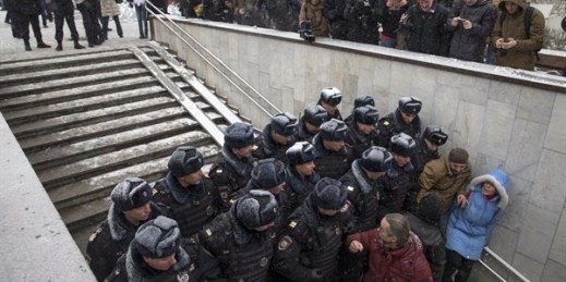 Police officers block people attending an opposition rally in Pushkin Square, Moscow, Russia, Dec. 12, 2015 (AP photo by Pavel Golovkin).