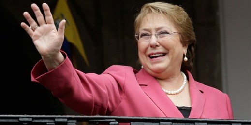 Chilean President Michelle Bachelet waves from a palace balcony, Quito, Ecuador, Oct. 15, 2015 (AP photo by Dolores Ochoa).