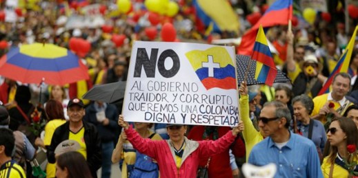 Colombians march to protest against President Juan Manuel Santos' government and peace talks with the Revolutionary Armed Forces of Colombia (FARC), Bogota, April 2, 2016 (AP photo by Fernando Vergara).