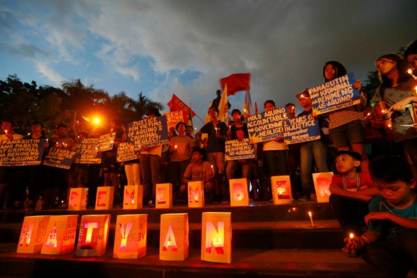 Candles are lit to commemorate the second anniversary of Typhoon Haiyan, Manila, Nov. 7, 2015 (AP photo by Bullit Marquez).