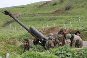 Karabakh Armenian soldiers near a howitzer in Hadrut province, Nagorno-Karabakh, April 5, 2016 (Photolure photo by Albert Khachatryan via AP).