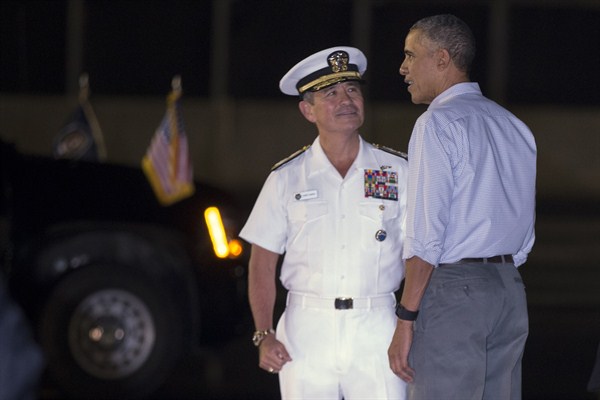 President Barack Obama and the head of the U.S. Pacific Command, Adm. Harry Harris, at Joint Base Pearl Harbor-Hickam, Honolulu, Hawaii, Dec. 19, 2015 (AP photo by Evan Vucci).