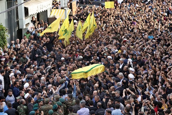 Hezbollah supporters carry the coffin of slain commander Mustafa Badreddine during his funeral procession, southern Beirut, Lebanon, May 13, 2016 (AP photo by Hassan Ammar).
