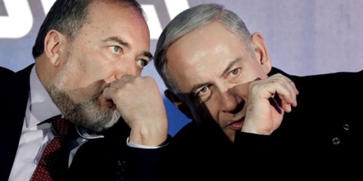Prime Minister Benjamin Netanyahu and former Foreign Minister Avigdor Lieberman during a Likud-Yisrael Beitenu campaign rally, Ashdod, Israel, Jan. 16, 2013 (AP photo by Tsafrir Abayov).