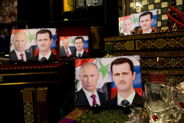 Porcelain photos decorated with the images of Russian President Vladimir Putin and Syrian President Bashar al-Assad in a shop in Damascus, April 18, 2016 (AP photo by Hassan Ammar).