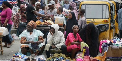 People crowd around market stalls, Lagos, Nigeria, June 20, 2016 (AP photo by Sunday Alamba).