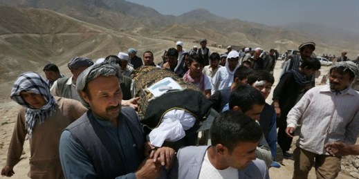 Afghan men carry the coffin of a relative who died in a suicide attack in Kabul, Afghanistan, July 25, 2016 (AP photos by Rahmat Gul).