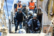 Chinese soldiers board a U.S. Coast Guard boat as part of a Rim of the Pacific (RIMPAC) exercise, Pacific Ocean, July 16, 2014 (U.S Coast Guard photo by Manda M. Emery).