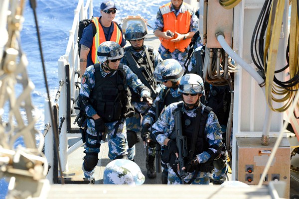 Chinese soldiers board a U.S. Coast Guard boat as part of a Rim of the Pacific (RIMPAC) exercise, Pacific Ocean, July 16, 2014 (U.S Coast Guard photo by Manda M. Emery).
