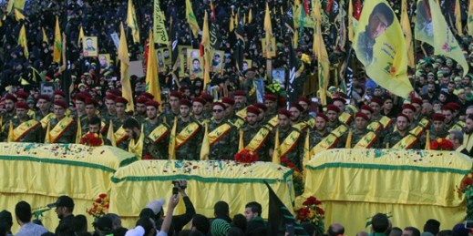 Relatives and comrades pray as they surround the Hezbollah flag-draped coffins of Shiite fighters who were killed in Syria, Nabatiyeh, Lebanon, Oct. 27, 2015 (AP photo by Mohammed Zaatari).