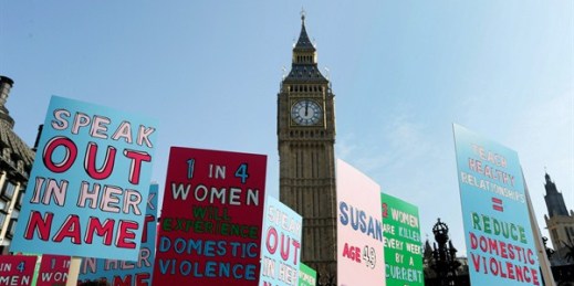 Protesters hold banners during a demonstration against domestic violence, London, U.K., March 5, 2013 (AP photo by Kirsty Wigglesworth).
