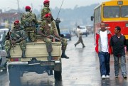 In this June 10, 2005 file photo, Ethiopian soldiers patrol the streets of Addis Ababa, after clashes with protesters (AP photo by Karel Prinsloo).
