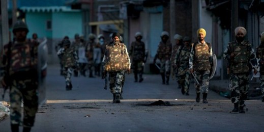 Indian paramilitary soldiers walk back toward their base camp on the eleventh straight day of curfew, Kashmir, July 19, 2016 (AP photo by Dar Yasin).