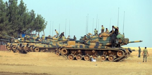 Turkish troops check their tanks near the Syrian border, Karkamis, Turkey, Aug. 26, 2016 (Ismail Coskun, IHA via AP).