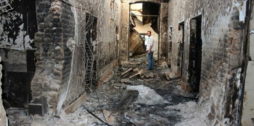 An employee of Doctors Without Borders stands inside the charred remains of their hospital after it was hit by a U.S. airstrike, Kunduz, Afghanistan, Oct. 16, 2015 (AP photo by Najim Rahim).