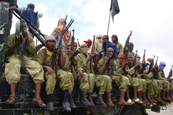 Al-Shabab fighters sit on a truck as they patrol Mogadishu, Somalia, Oct. 30, 2009 (AP photo by Mohamed Sheikh Nor).