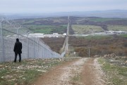 A police officer stands guard on the Bulgarian-Turkey border, near Lesovo, Bulgaria, Dec. 04, 2015 (Bulgarian Government via AP).