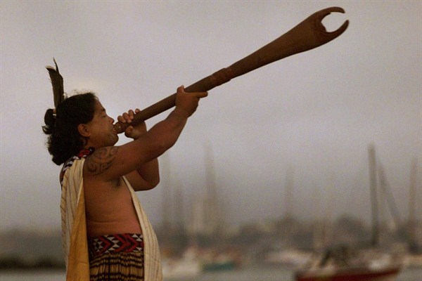 A Maori warrior with a traditional Maori trumpet, Auckland, New Zealand, Jan. 1, 2000 (AP photo by David Guttenfelder).