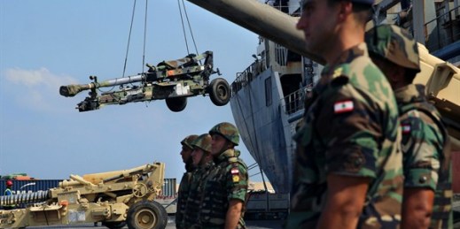 Lebanese troops stand guard as weapons from the United States are unloaded at Beirut's port, Aug. 9, 2016 (AP photo by Bilal Hussein).