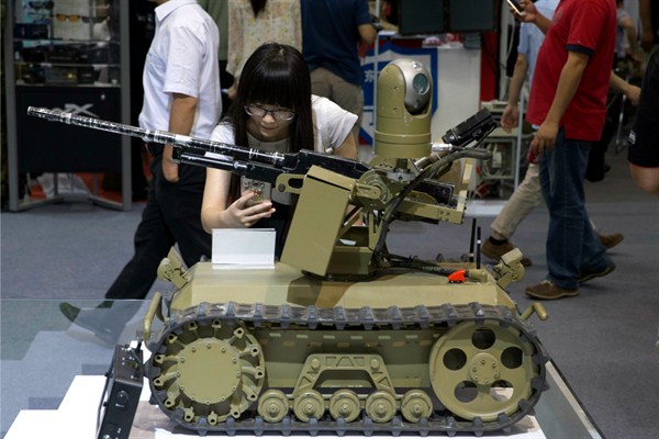 A remote-controlled weaponized robot on display at the 8th China International Exhibition on Police Equipment, Beijing, China, May 19, 2016 (AP photo by Ng Han Guan).