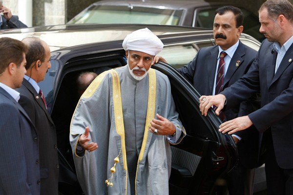 Escorted by bodyguards, Omani Sultan Qaboos arrives for an official welcoming ceremony, Tehran, Iran, Aug. 4, 2009 (AP photo by Vahid Salemi).