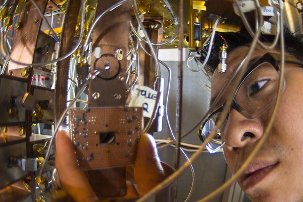 An IBM Research scientist conducts a quantum computing experiment at IBM's Thomas J. Watson Research Center, Yorktown Heights, N.Y., Oct. 9, 2014 (Jon Simon, Feature Photo Service for IBM).