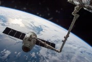 The SpaceX Dragon cargo spaceship is grabbed by the International Space Station's Canadarm, April 10, 2016 (NASA photo).