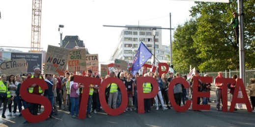 Protesters hold an anti-CETA banner during a demonstration against international trade agreements, Brussels, Belgium, Sept. 20, 2016 (AP photo by Virginia Mayo).