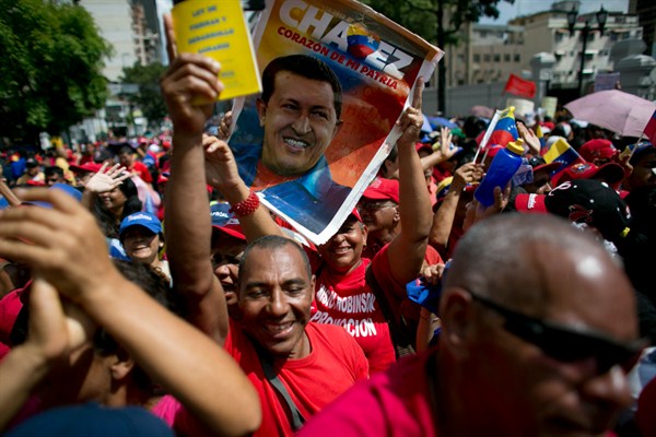 Supporters of the government and of late Venezuelan President Hugo Chavez at a rally in Caracas, Oct. 28, 2016 (AP photo by Ariana Cubillos).