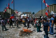 Public workers protest outside La Moneda presidential palace, Santiago, Chile, Nov. 17, 2016 (AP photo by Luis Hidalgo).