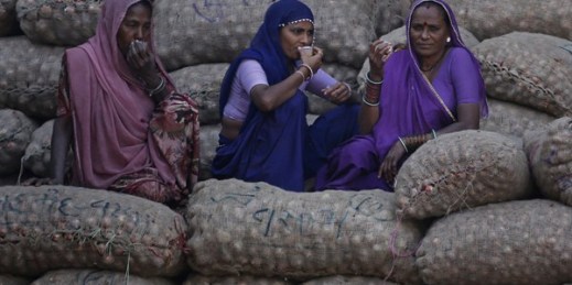 Women laborers take a break at an agriculture market, Ahmadabad, India, Nov. 23, 2016 (AP photo by Ajit Solanki).