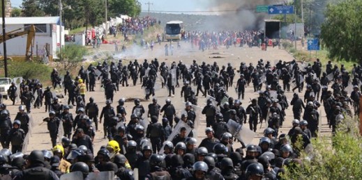 Riot police battling protesting teachers who were blocking a federal highway, Oaxaca, Mexico June 19, 2016 (AP Photo by Luis Alberto Cruz Hernandez).
