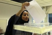A Saudi woman casts her ballot at a polling center during municipal elections, Riyadh, Saudi Arabia, Dec. 12, 2015 (AP photo by Aya Batrawy).