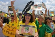 Demonstrators protest against corruption outside the National Congress, Brasilia, Brazil, Dec. 4, 2016 (AP photo by Eraldo Peres).