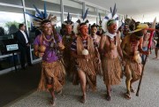 Pataxo indigenous perform a ritual dance as they block the main entrance of Planalto presidential palace, Brasilia, Brazil, Nov. 22, 2016 (AP photo by Eraldo Peres).
