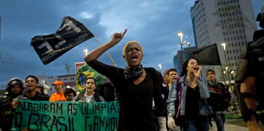 Students protest against the money spent on the 2016 Olympics, Rio de Janeiro, Brazil, Aug. 21, 2016 (AP photo by Silvia Izquierdo).