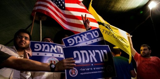 Israelis wave flags and hold signs reading "Trump, the Israeli interest" during a rally, Jerusalem, Oct. 26, 2016 (AP photo by Tsafrir Abayov).