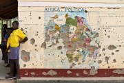 Students outside a classroom with a map of Africa on its wall, Yei, southern South Suda, Nov. 15, 2016 (AP photo by Justin Lynch).