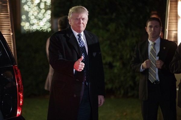 President-elect Donald Trump arrives for a party at the home of a campaign donor, Head of the Harbor, N.Y., Dec. 3, 2016 (AP photo by Evan Vucci).