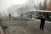 Security officials at the scene of a car bombing in the central Anatolian city of Kayseri, Turkey, Dec. 17, 2016. (IHA via AP).
