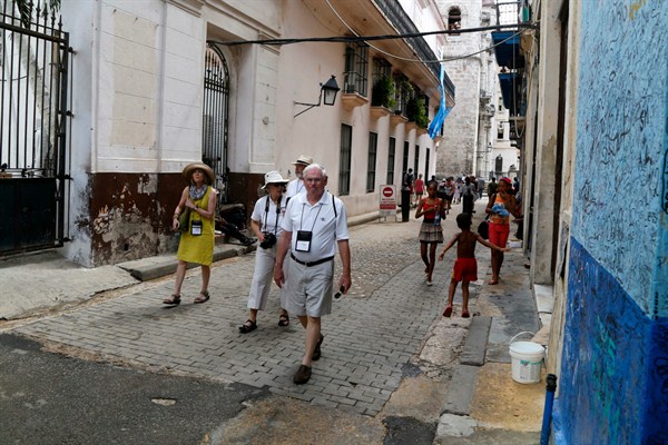 U.S. tourists walk outside the Bodeguita del Medio Bar, Havana, Cuba, May 24, 2015 (AP photo by Desmond Boylan).