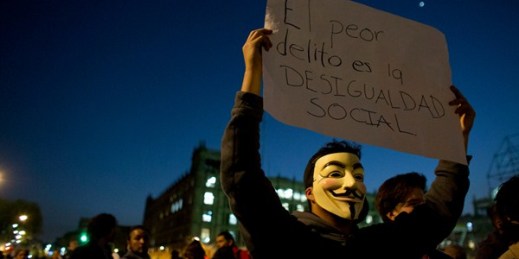 A protester with a sign reading in Spanish "the worst crime is social inequality," Mexico City, Jan. 9, 2017 (AP photo by Rebecca Blackwell).