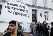 Syrian refugees seeking asylum hold banners outside the Swedish Embassy in Copenhagen, Denmark, Sept. 26, 2012 (AP Photo by Jens Dresling).