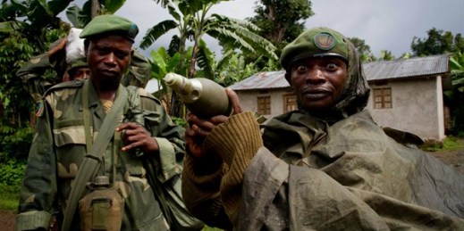 A Congolese soldier displays a mortar round after his unit returned from fighting against rebel forces, Kinyamahura, Congo, May 17, 2012 (AP photo by Marc Hofer)