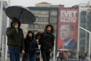 Istanbul's Taksim Square, backdropped by a poster of Turkish President Recep Tayyip Erdogan, March 14, 2017 (AP photo by Lefteris Pitarakis).
